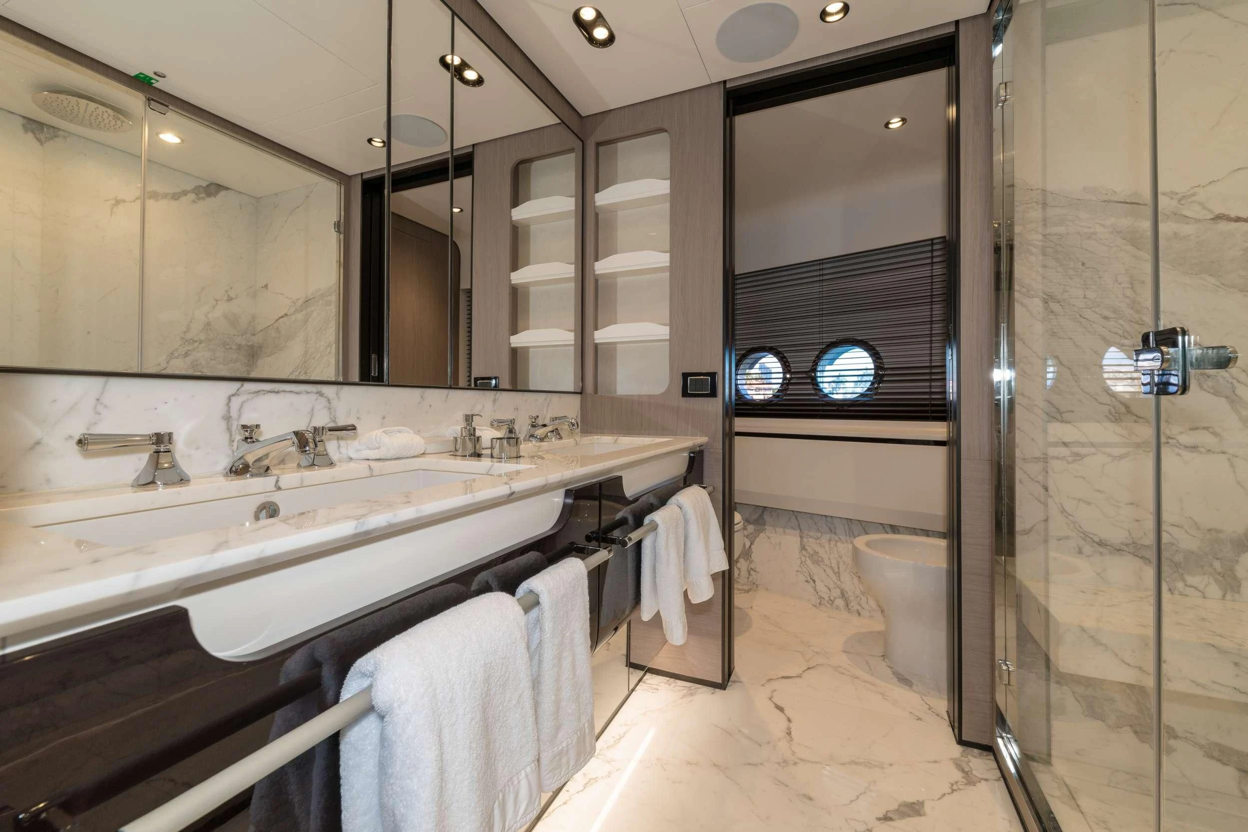 a bathroom with a large mirror aboard MAJESTIC MOMENTS Yacht for Sale