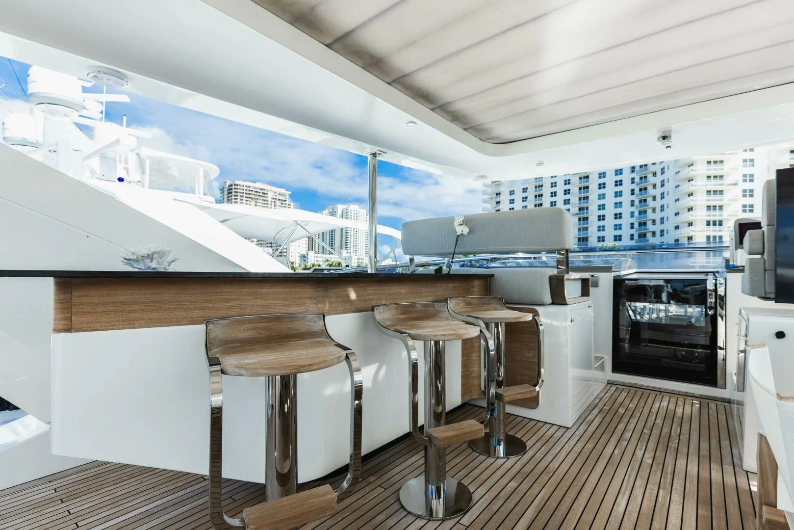 a room with a table and chairs aboard MAJESTIC MOMENTS Yacht for Sale