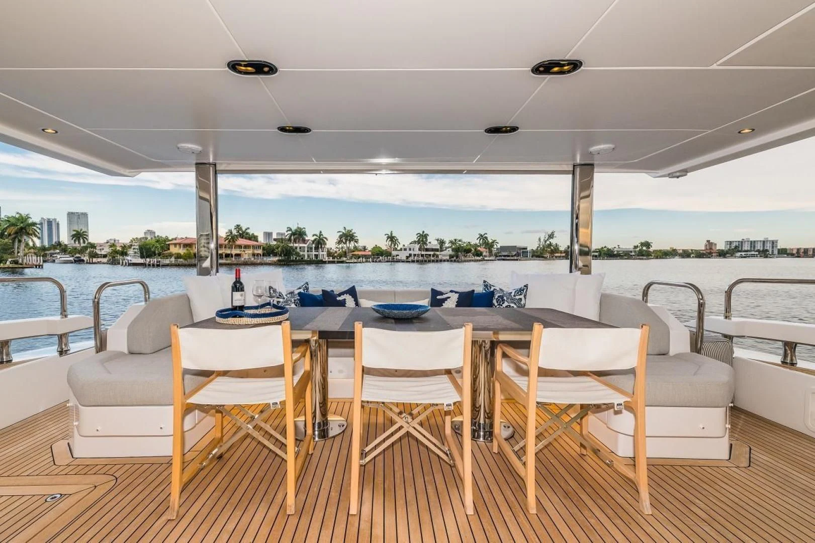 a table and chairs on a deck aboard MAJESTIC MOMENTS Yacht for Sale