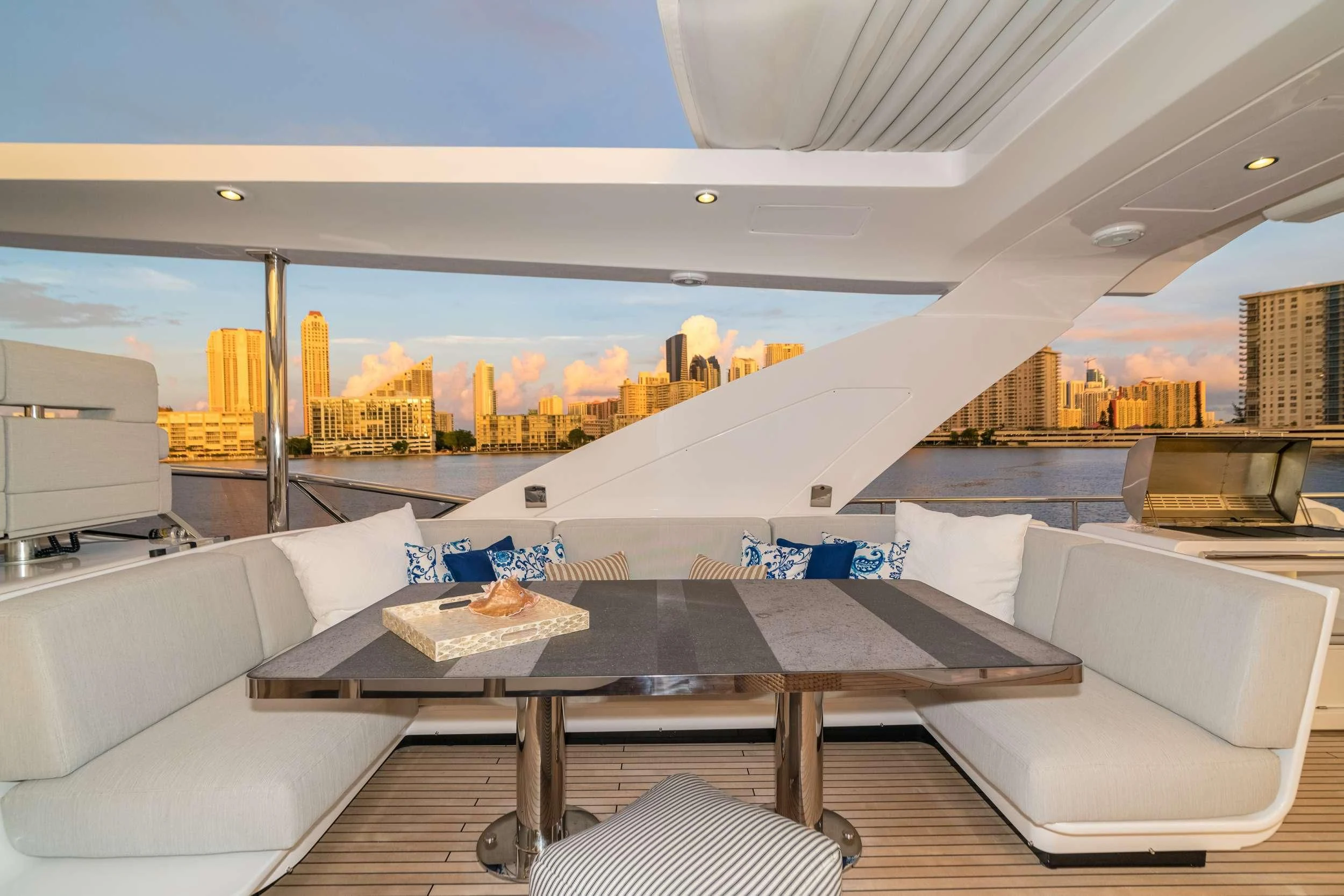 a room with a table and chairs aboard MAJESTIC MOMENTS Yacht for Sale