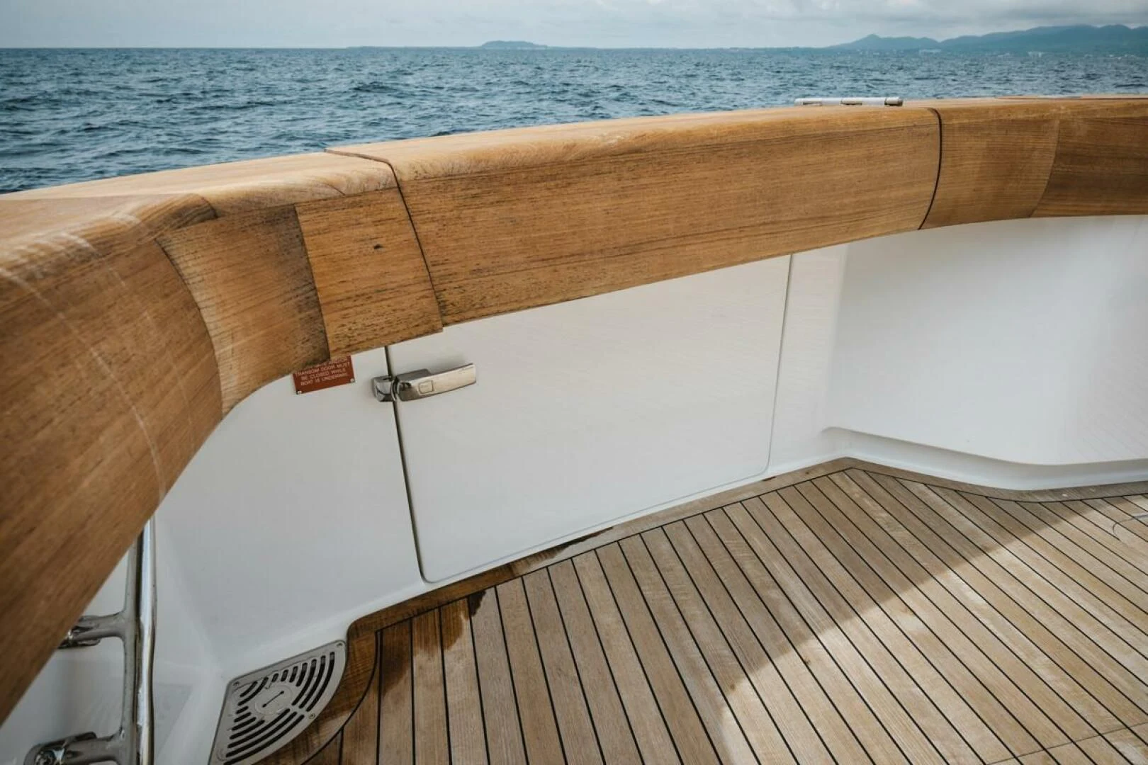 a wooden boat on a deck aboard WHY WOULDN'T WE Yacht for Sale