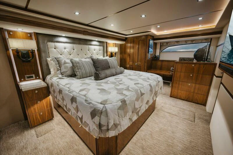 a bedroom with a large bed aboard WHY WOULDN'T WE Yacht for Sale
