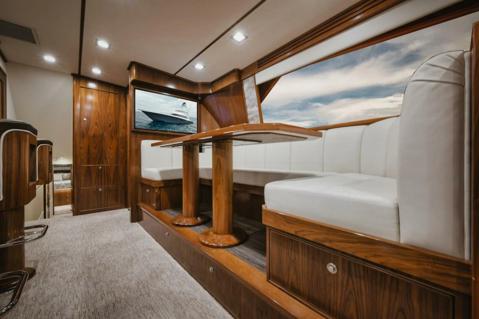 a room with a couch and a table aboard WHY WOULDN'T WE Yacht for Sale
