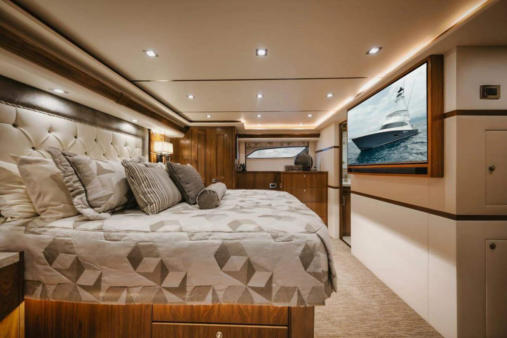 a bedroom with a bed and a television aboard WHY WOULDN'T WE Yacht for Sale