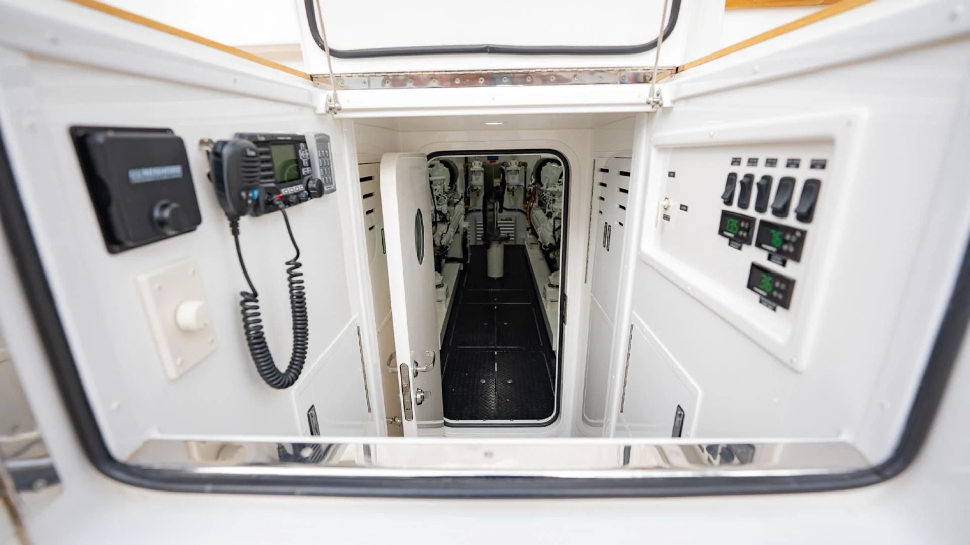 a white machine with a black and white panel aboard WHY WOULDN'T WE Yacht for Sale