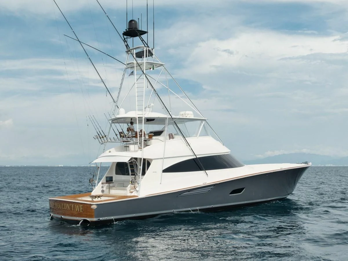 a boat on the water aboard WHY WOULDN'T WE Yacht for Sale