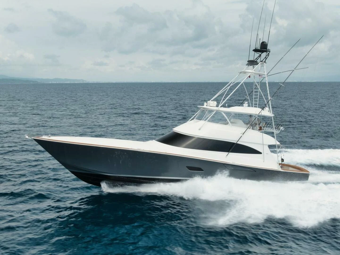 a white boat on the water aboard WHY WOULDN'T WE Yacht for Sale