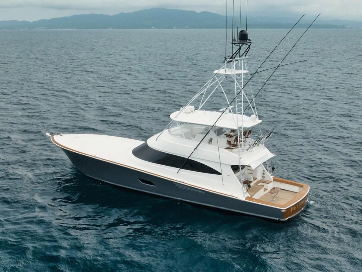 a white boat in the water aboard WHY WOULDN'T WE Yacht for Sale
