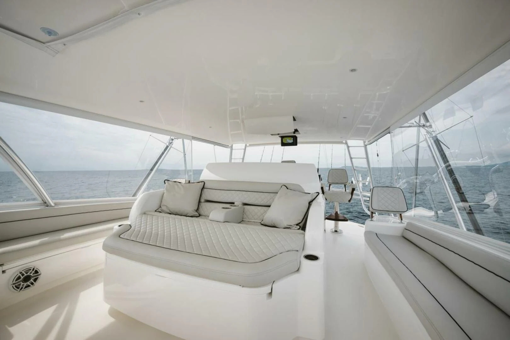 a boat with a bed and chairs aboard WHY WOULDN'T WE Yacht for Sale