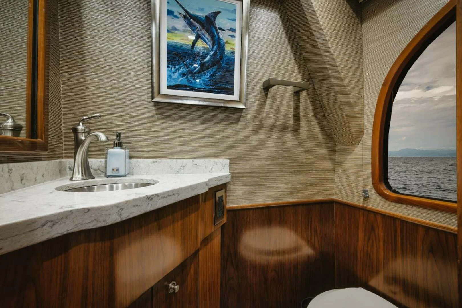 a bathroom with a sink and a window aboard WHY WOULDN'T WE Yacht for Sale