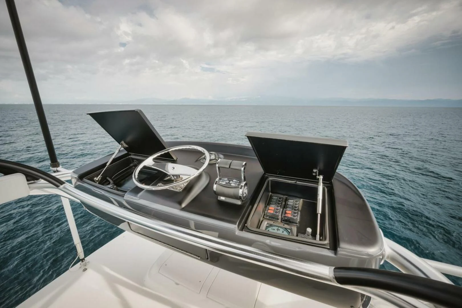 a boat with a steering wheel and seats on the front aboard WHY WOULDN'T WE Yacht for Sale