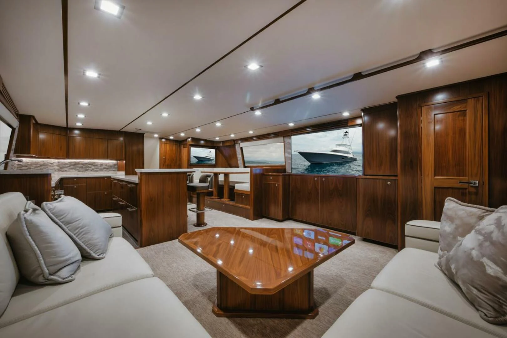 a room with a couch and a table aboard WHY WOULDN'T WE Yacht for Sale