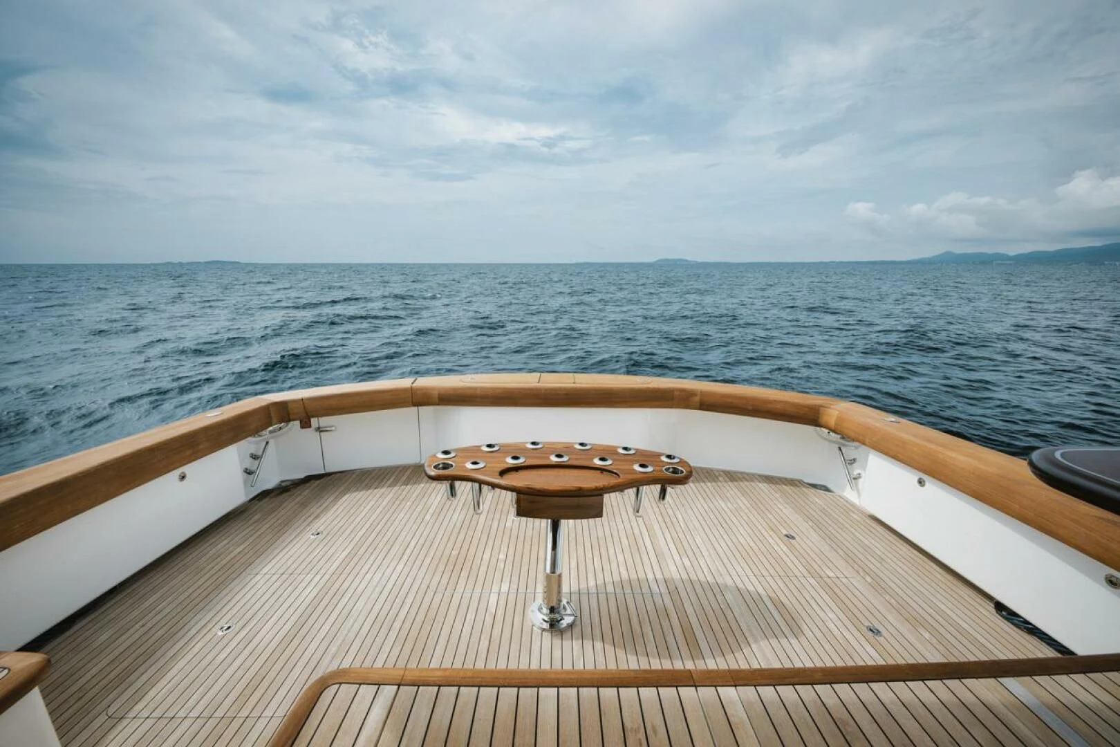 a wooden boat on a body of water aboard WHY WOULDN'T WE Yacht for Sale