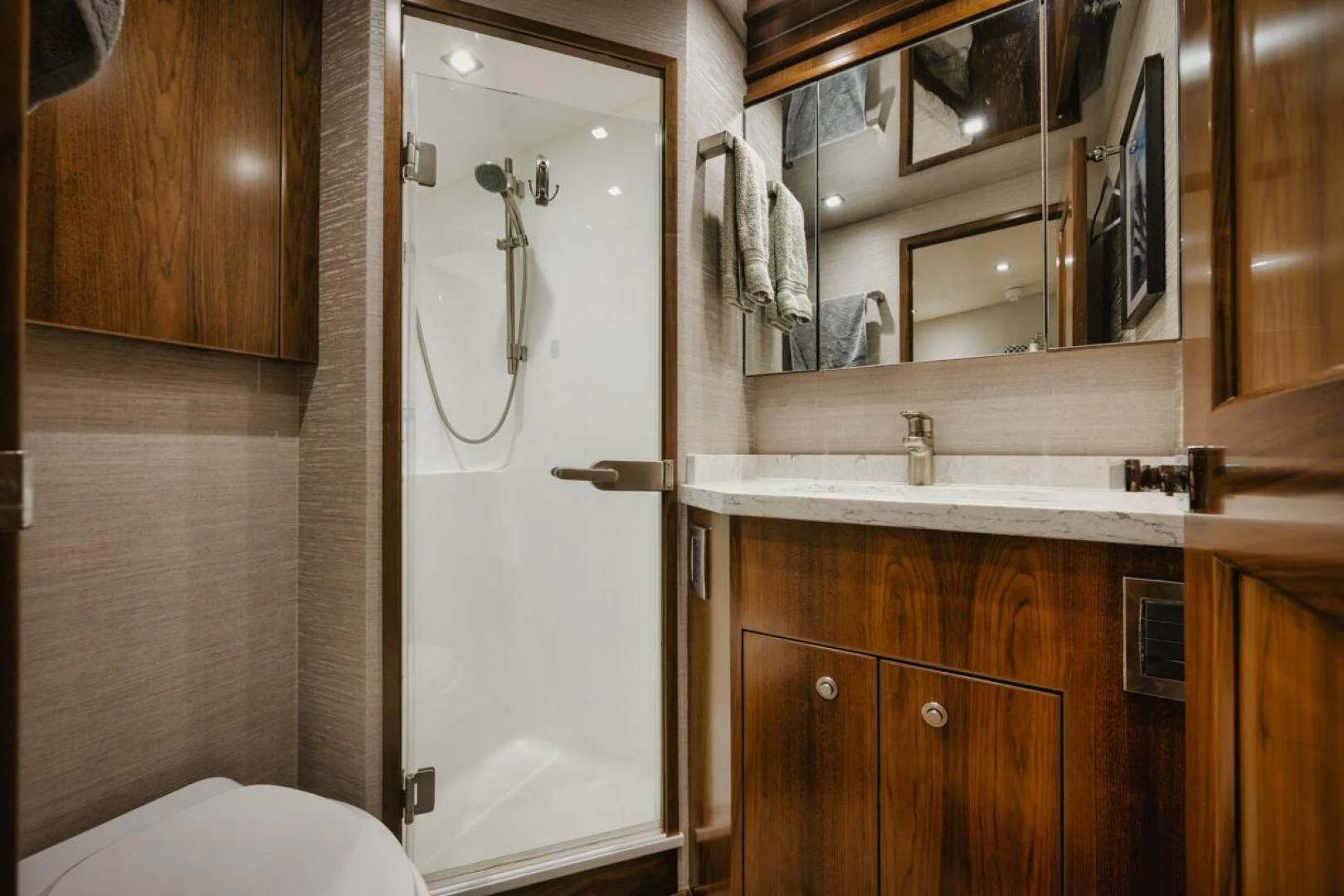 a bathroom with a shower and sink aboard WHY WOULDN'T WE Yacht for Sale