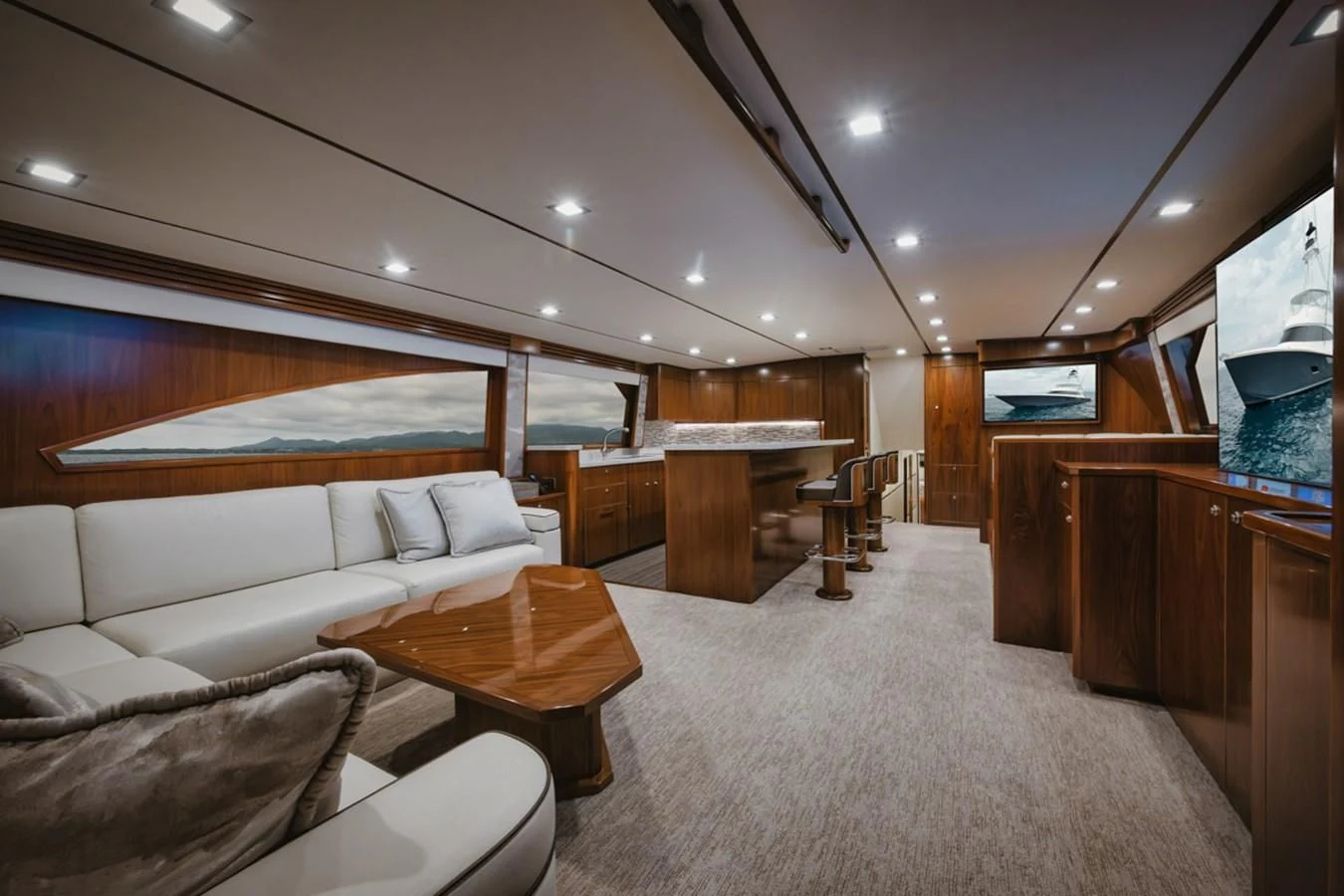 a living room with a couch and a table aboard WHY WOULDN'T WE Yacht for Sale
