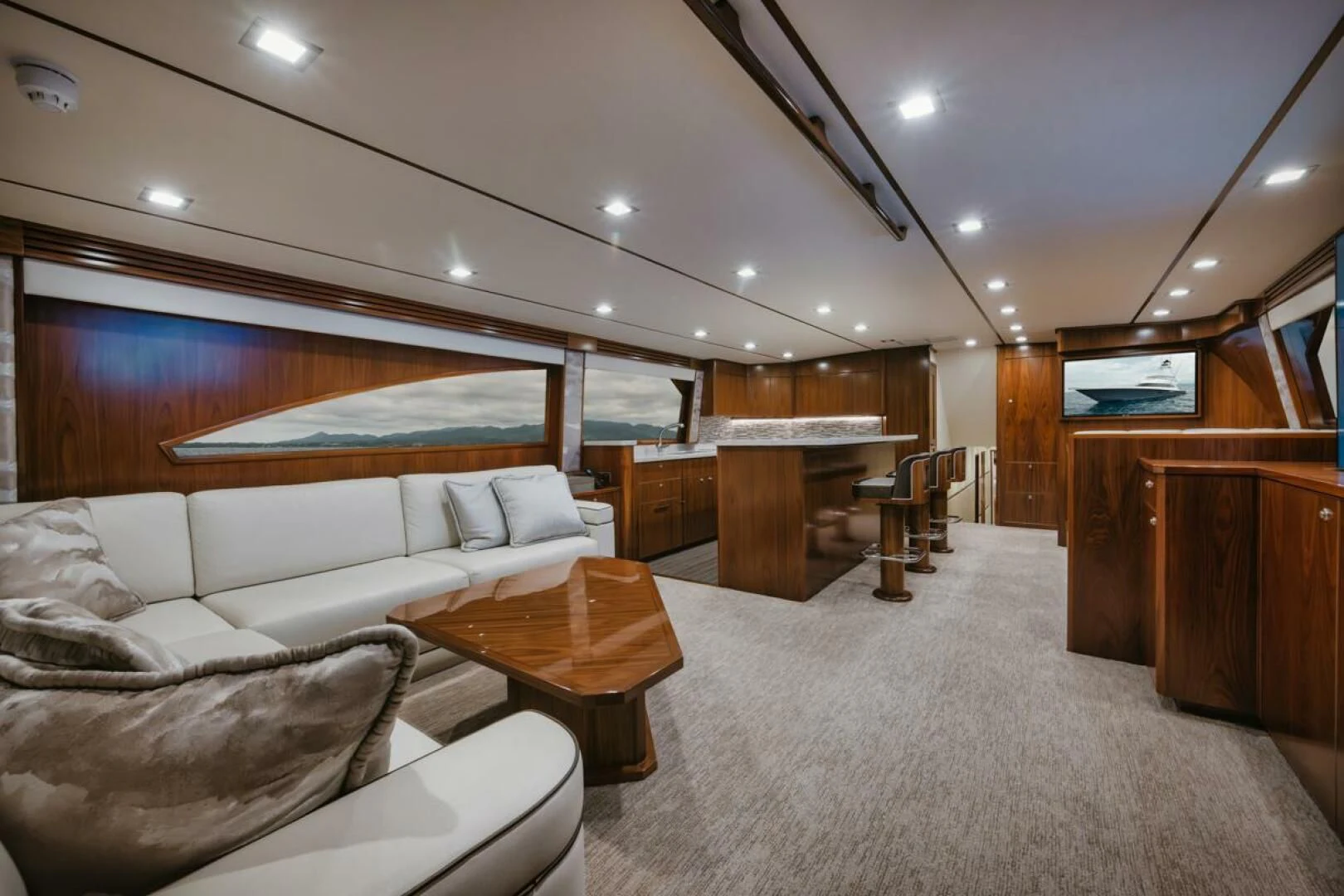 a living room with a large bed aboard WHY WOULDN'T WE Yacht for Sale