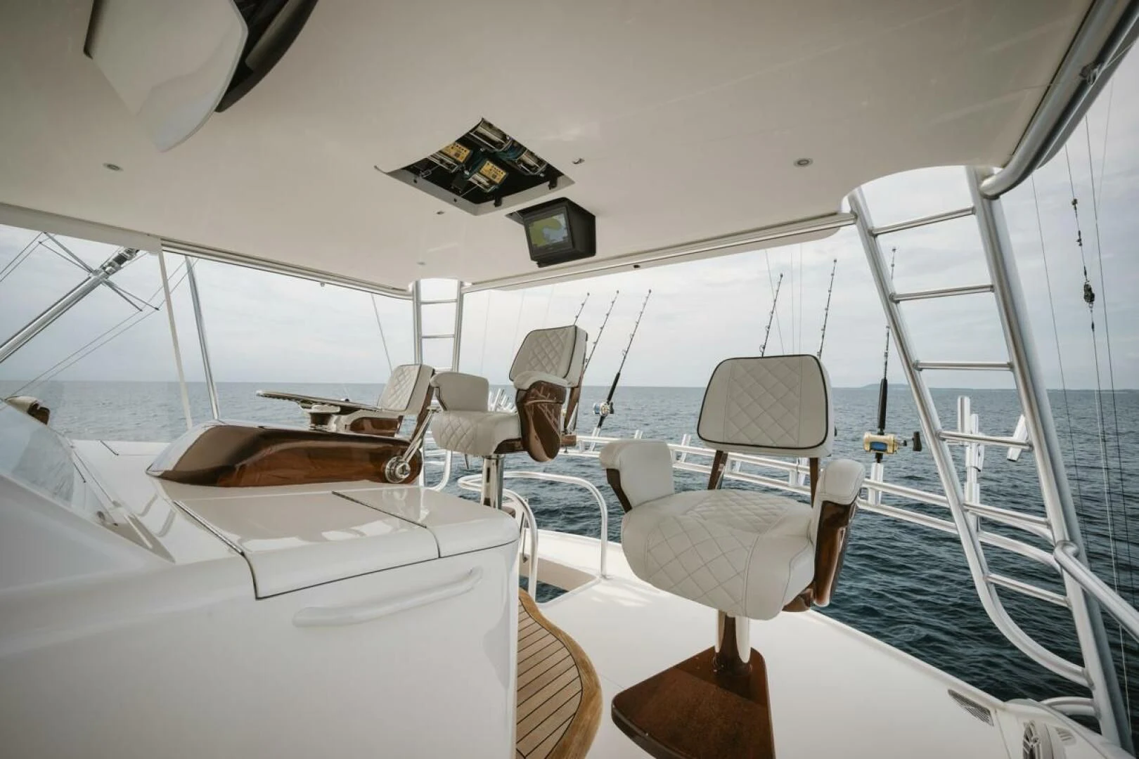 a person sitting on a boat aboard WHY WOULDN'T WE Yacht for Sale