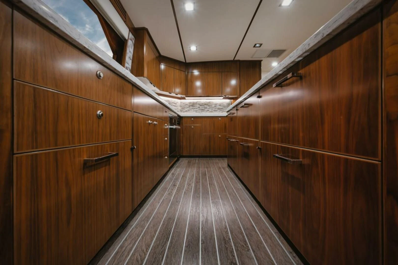a long wooden hallway aboard WHY WOULDN'T WE Yacht for Sale