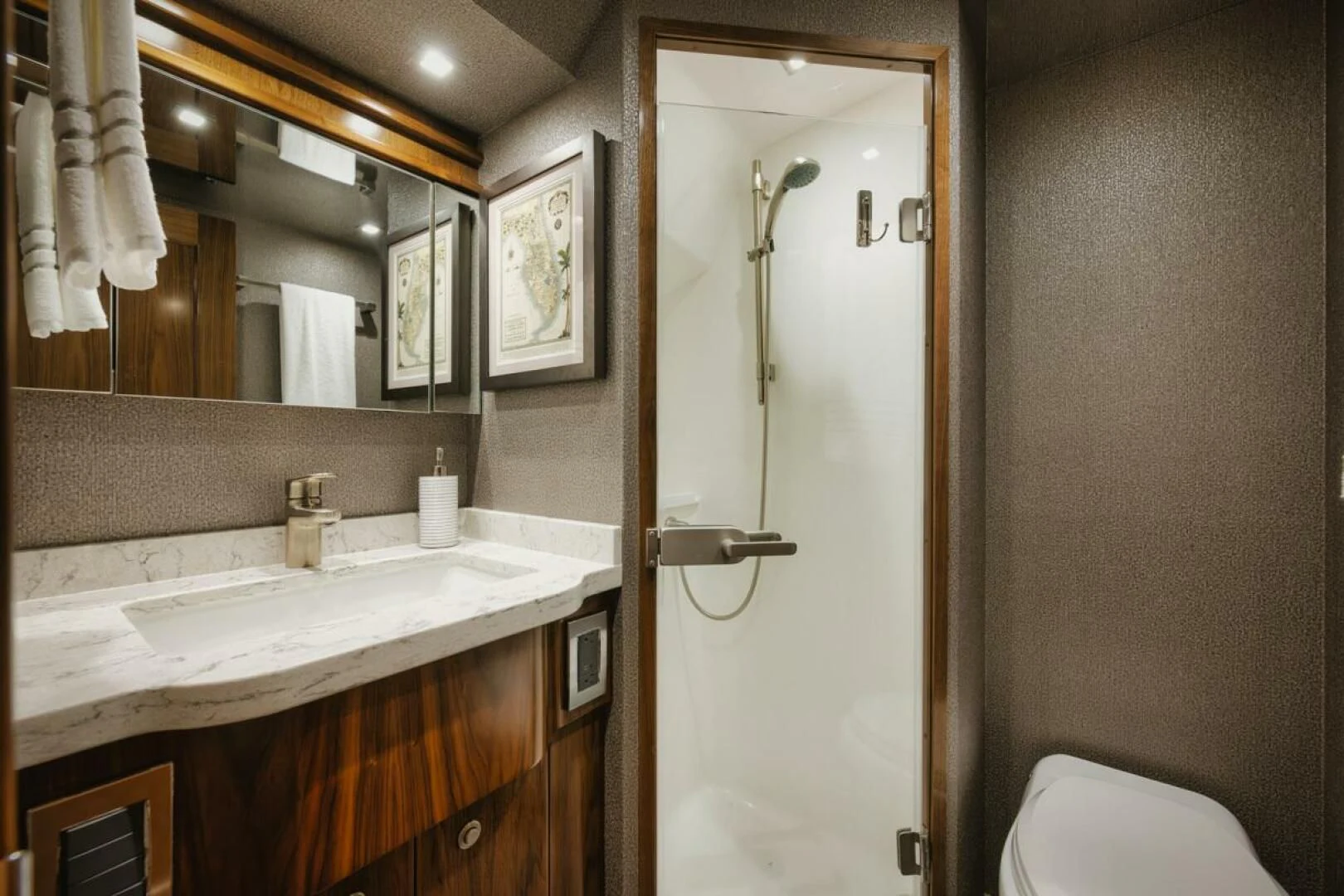 a bathroom with a sink and a mirror aboard WHY WOULDN'T WE Yacht for Sale