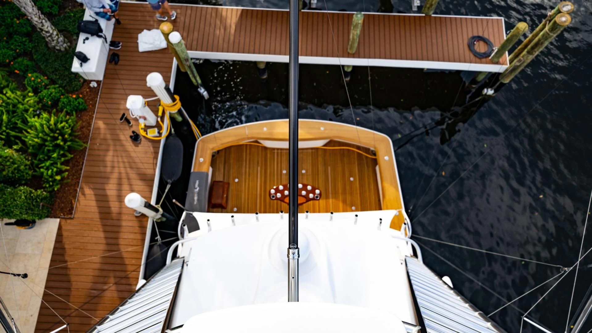 a small wooden boat on a dock aboard WHY WOULDN'T WE Yacht for Sale