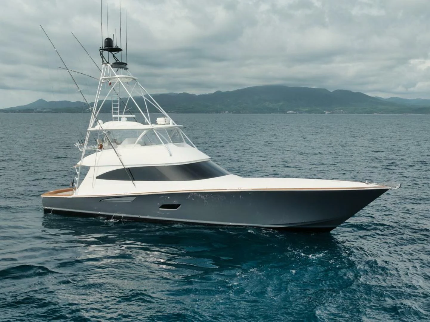 a white boat in the water aboard WHY WOULDN'T WE Yacht for Sale