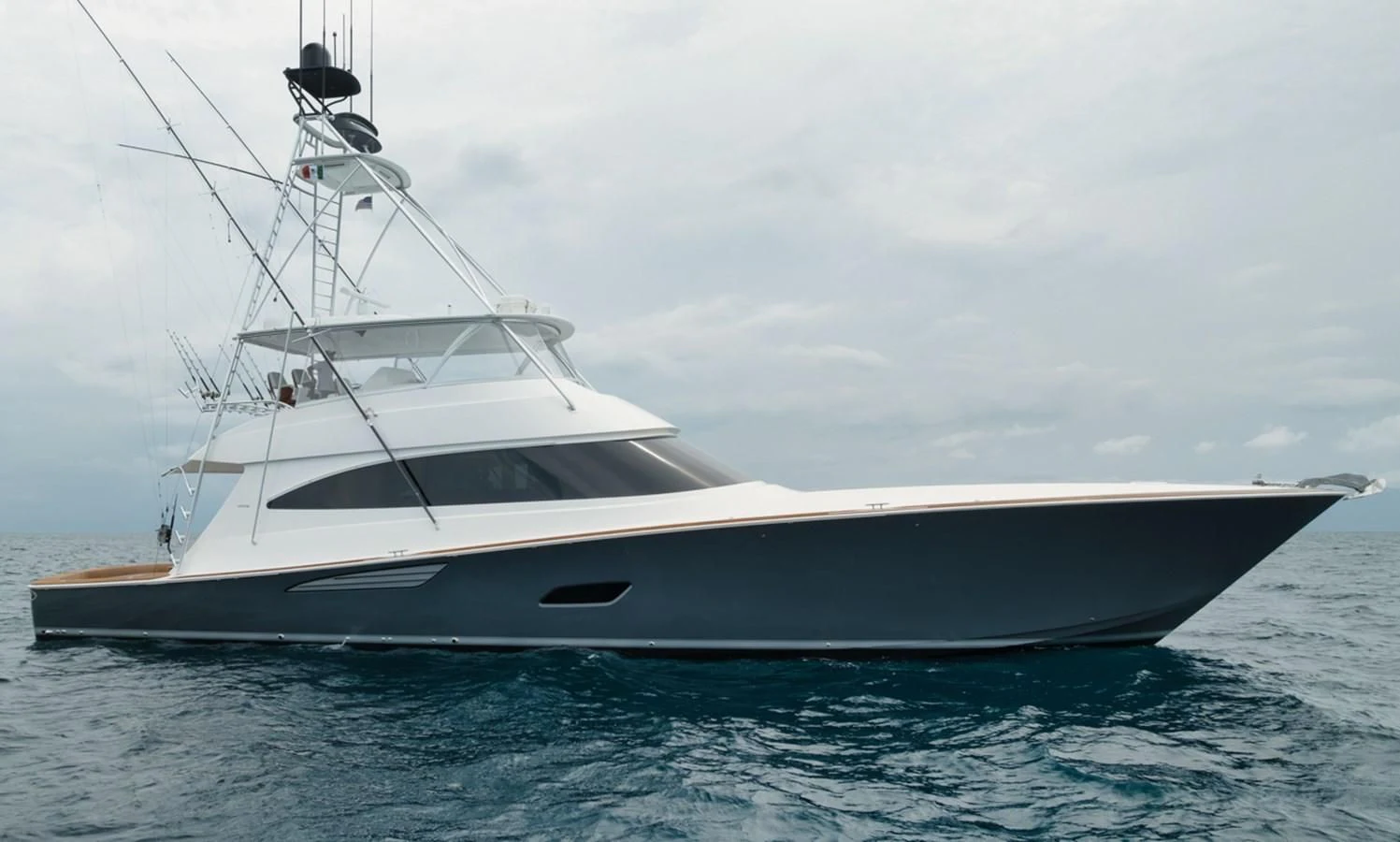 a white yacht in the water aboard WHY WOULDN'T WE Yacht for Sale