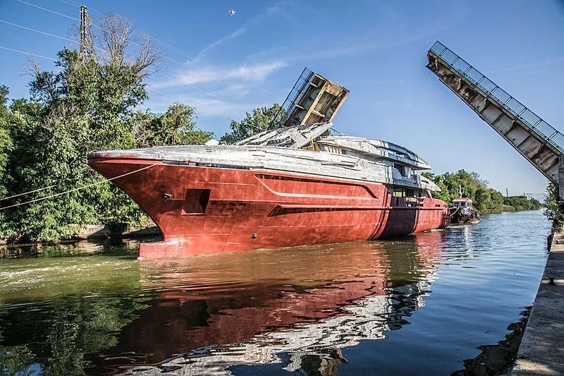 a rusted boat on a river aboard LION Yacht for Sale