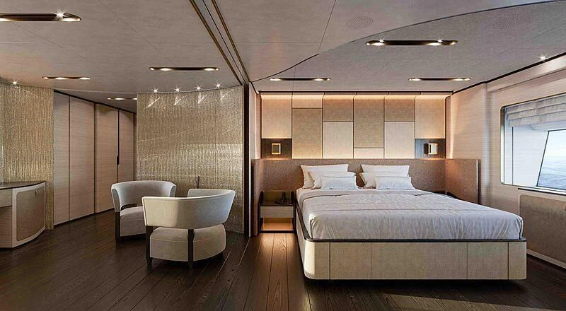 a large bedroom with a bed and a chair aboard LION Yacht for Sale