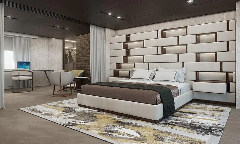 a large bed in a room aboard LION Yacht for Sale