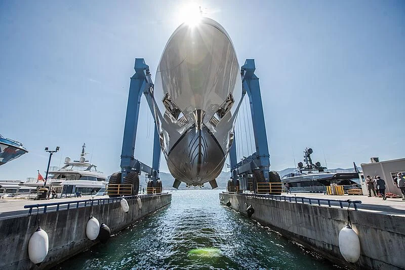 a large white and blue rocket ship aboard LION Yacht for Sale
