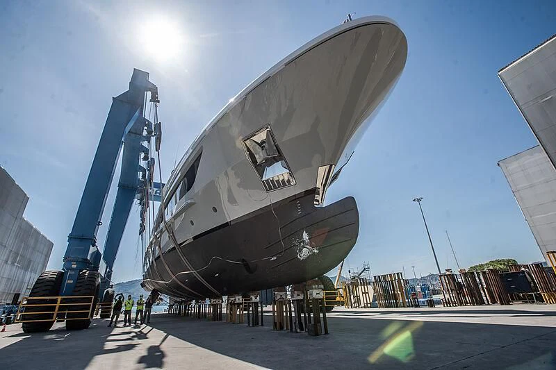 a large metal object with a group of people standing around it aboard LION Yacht for Sale
