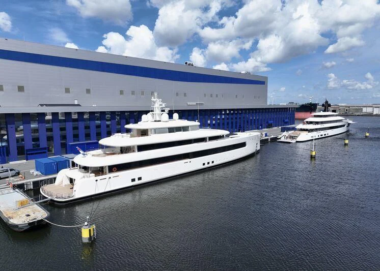a large cruise ship docked aboard SIBELLE Yacht for Sale
