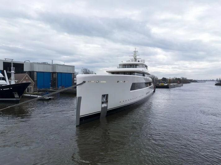 a large white boat sits in the water aboard SIBELLE Yacht for Sale