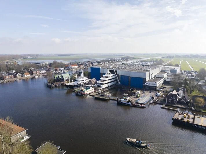a harbor with boats and buildings aboard SIBELLE Yacht for Sale