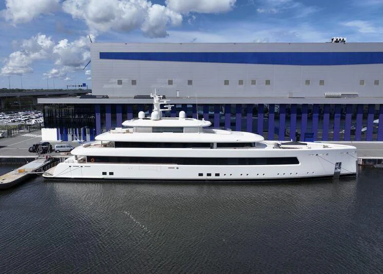 a large cruise ship docked aboard SIBELLE Yacht for Sale