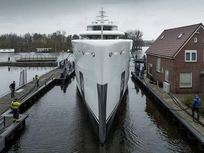 a large ship docked at a dock aboard SIBELLE Yacht for Sale
