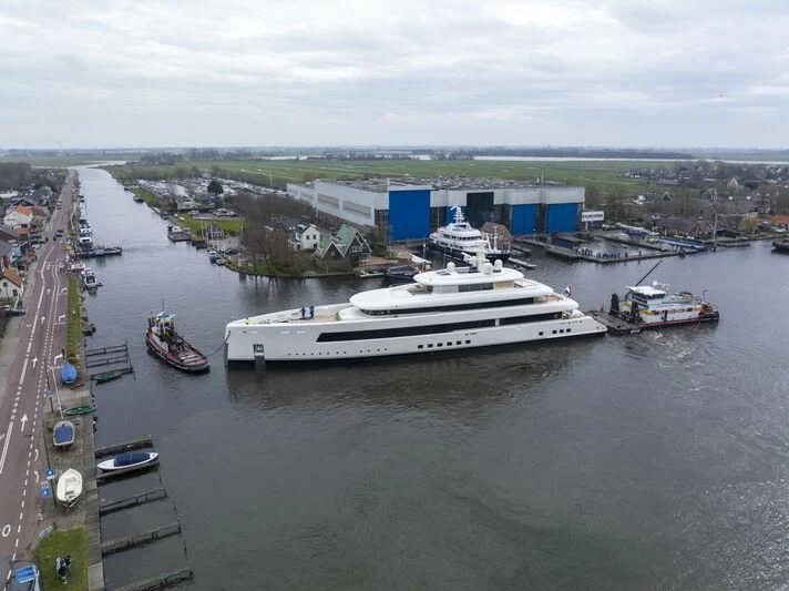 a large ship in the water aboard SIBELLE Yacht for Sale