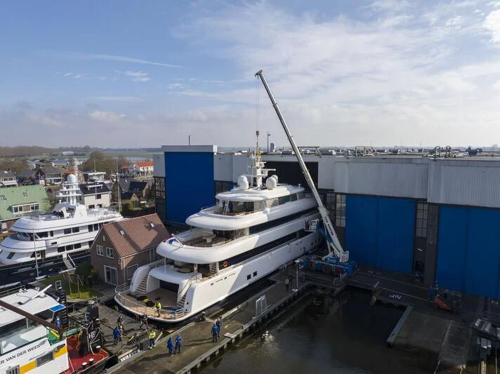 a large white boat docked aboard SIBELLE Yacht for Sale