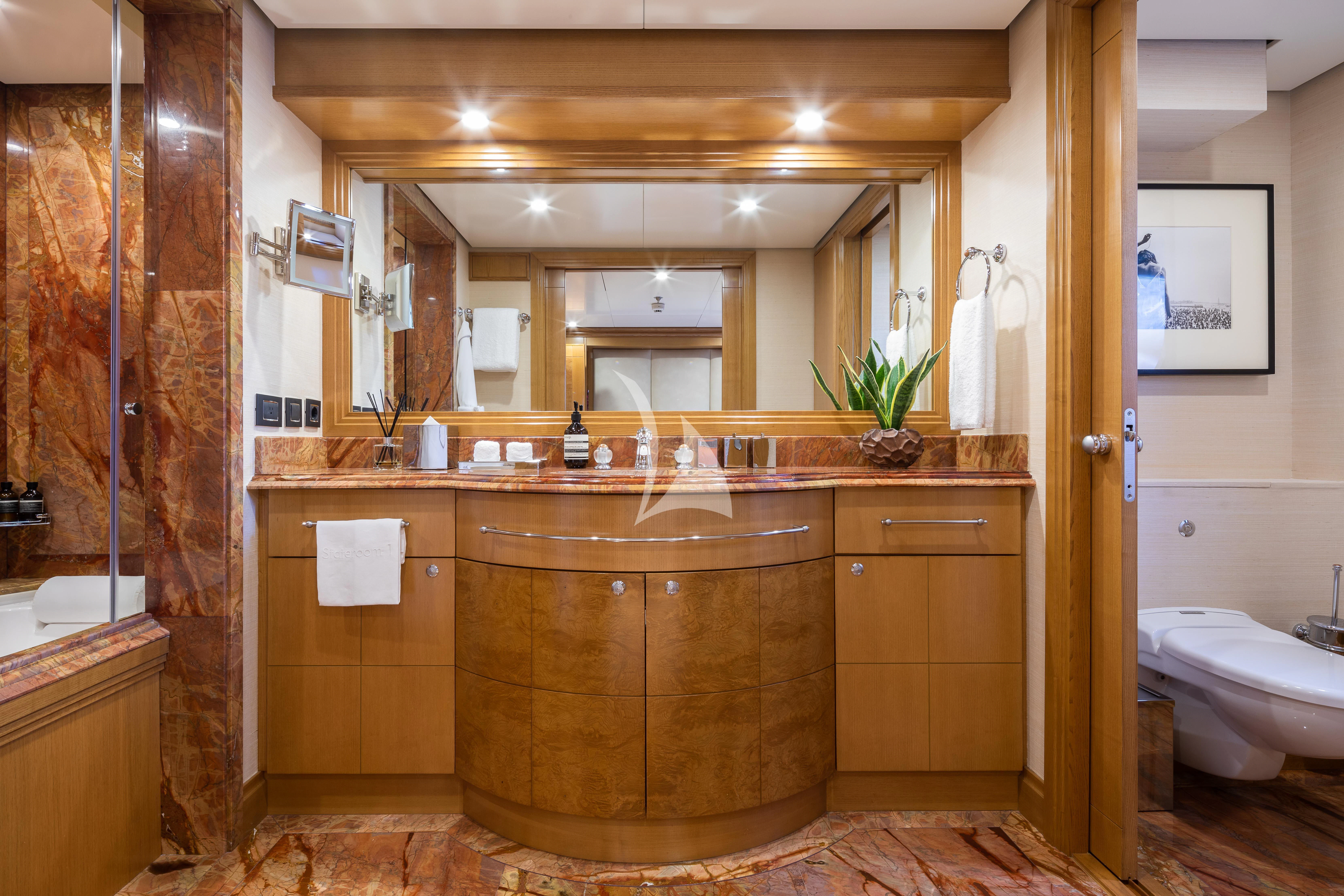 a bathroom with a large mirror aboard TREEHOUSE Yacht for Sale