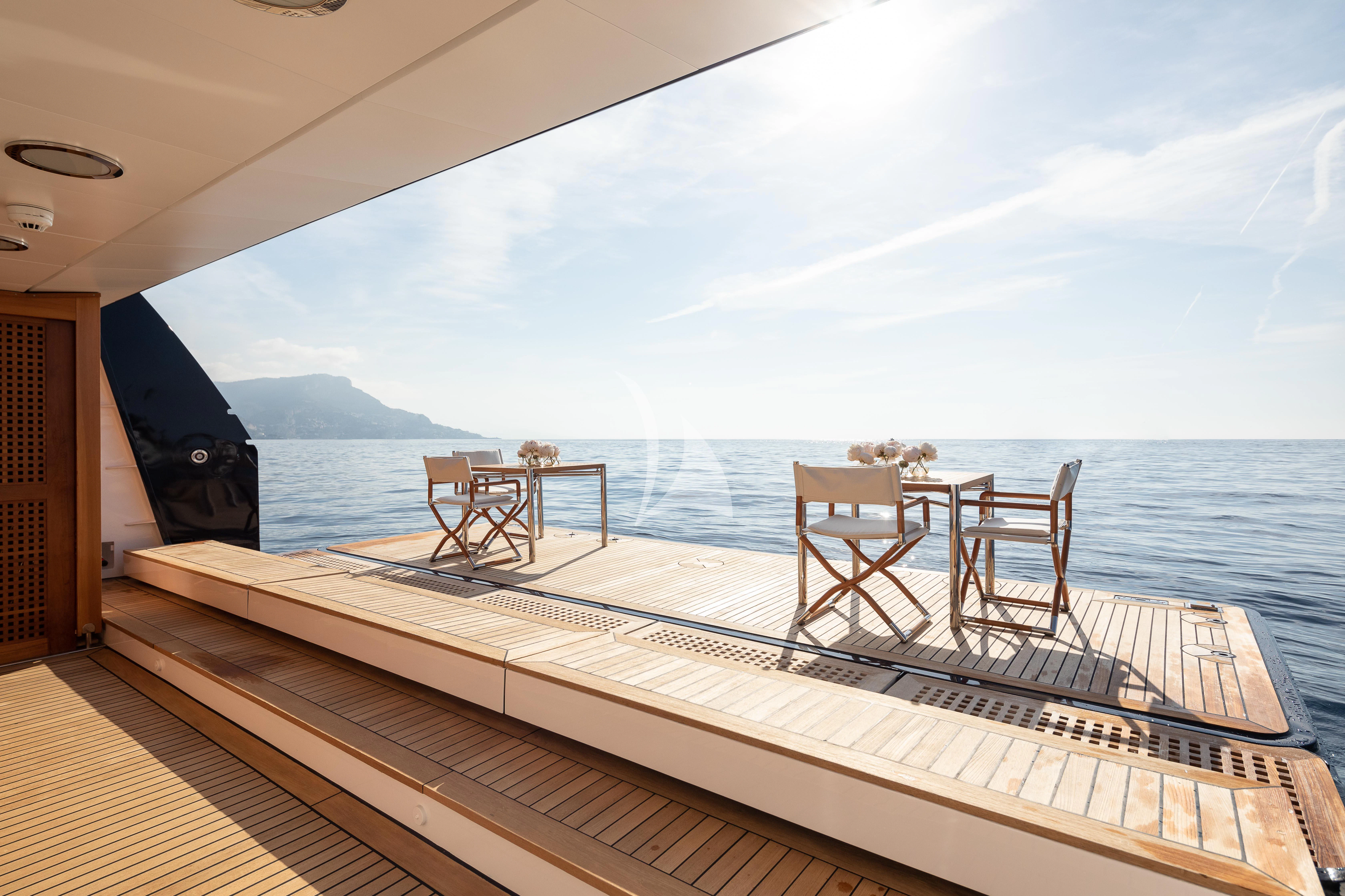 a deck with chairs on it aboard TREEHOUSE Yacht for Sale