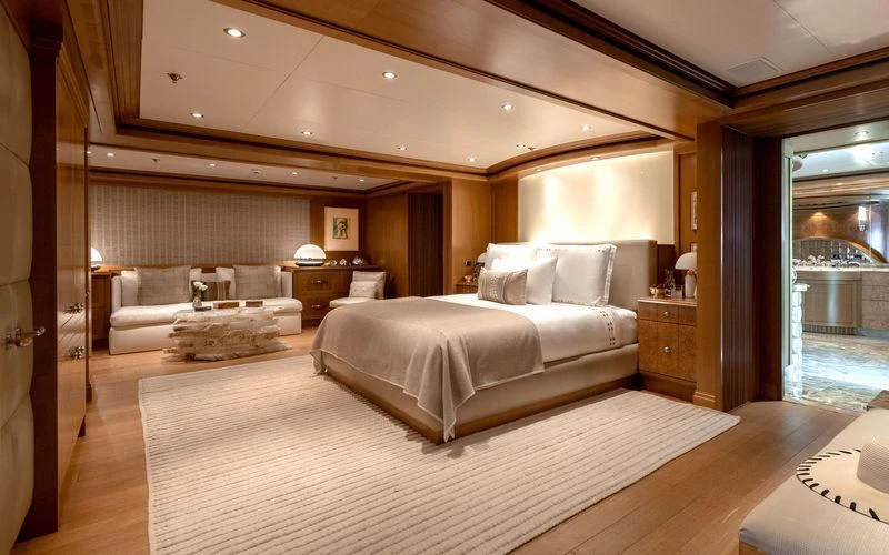 a large bedroom with a large bed aboard TREEHOUSE Yacht for Sale