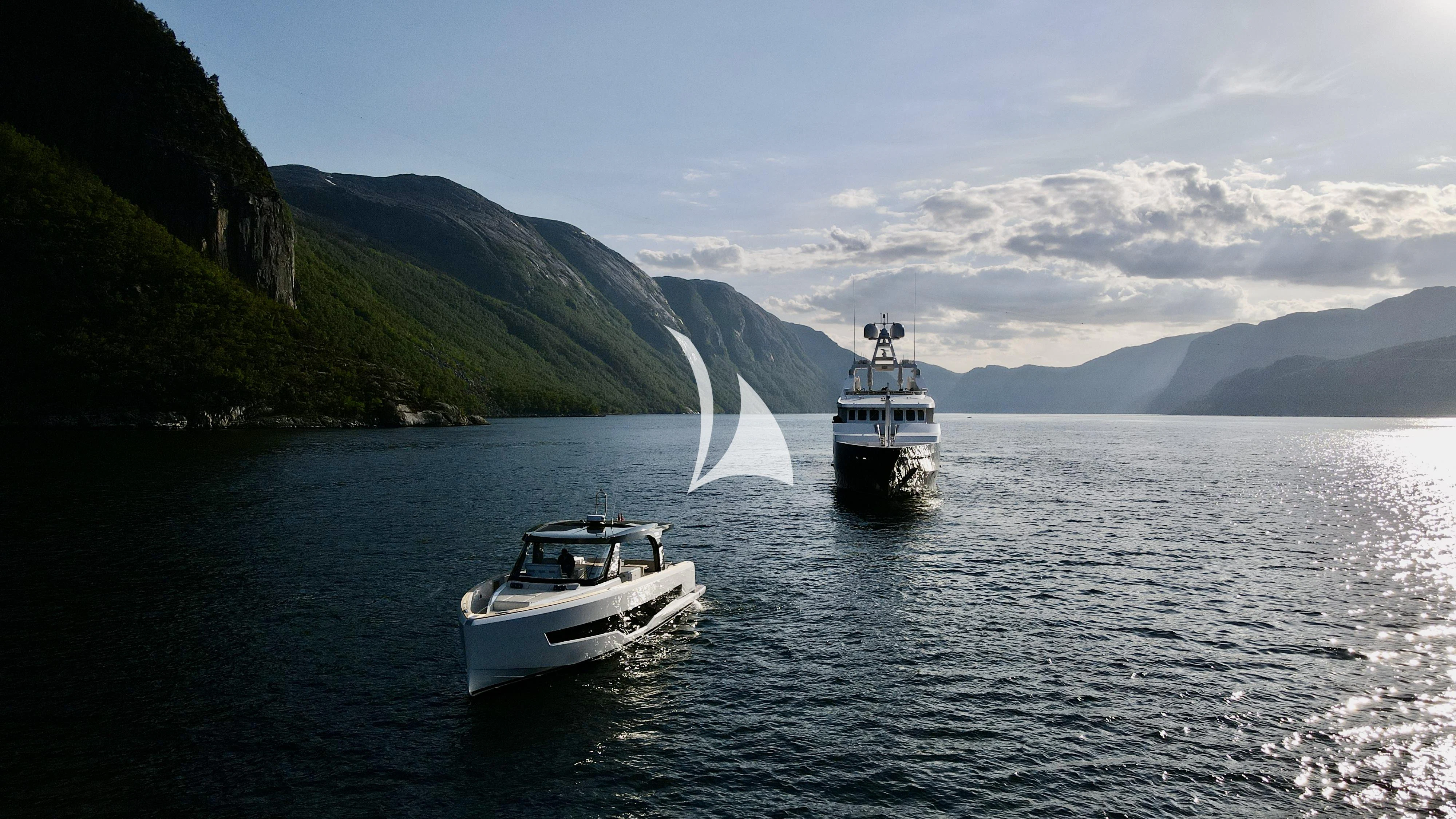 a couple of boats on the water aboard TREEHOUSE Yacht for Sale