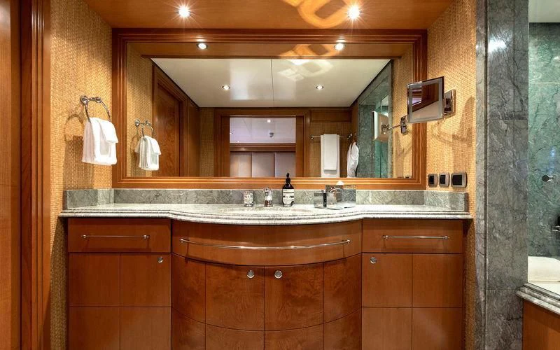 a bathroom with a large mirror aboard TREEHOUSE Yacht for Sale