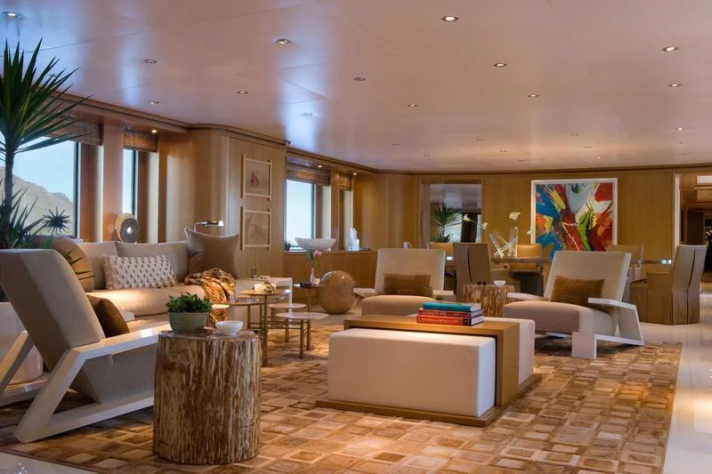 a living room with a large sofa aboard TREEHOUSE Yacht for Sale