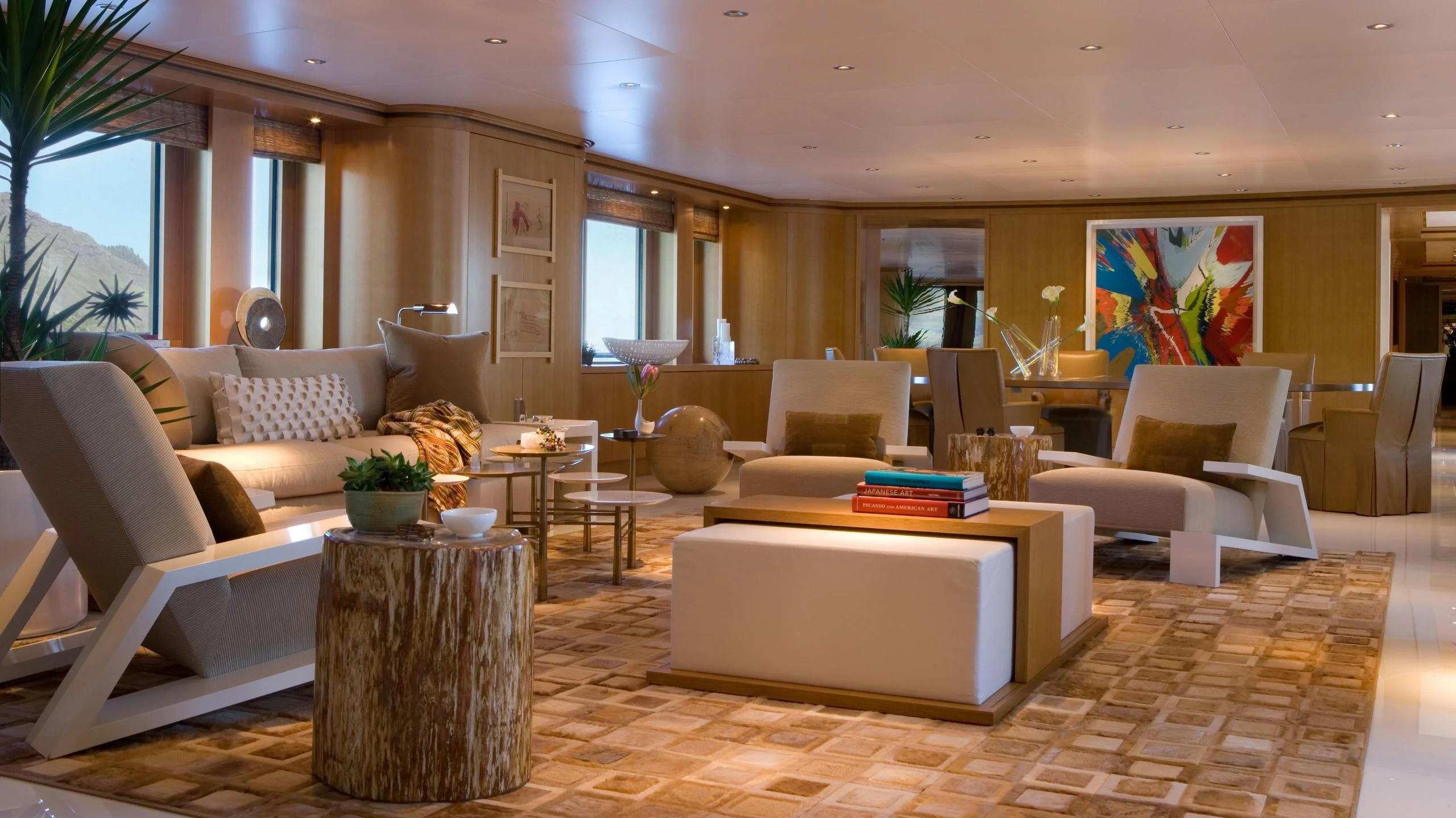 a living room with a couch and a table aboard TREEHOUSE Yacht for Sale