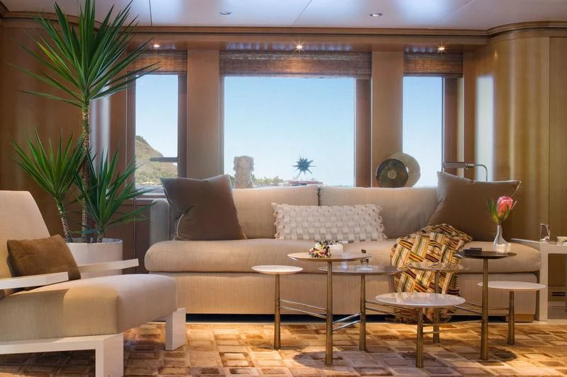 a living room with a large window aboard TREEHOUSE Yacht for Sale