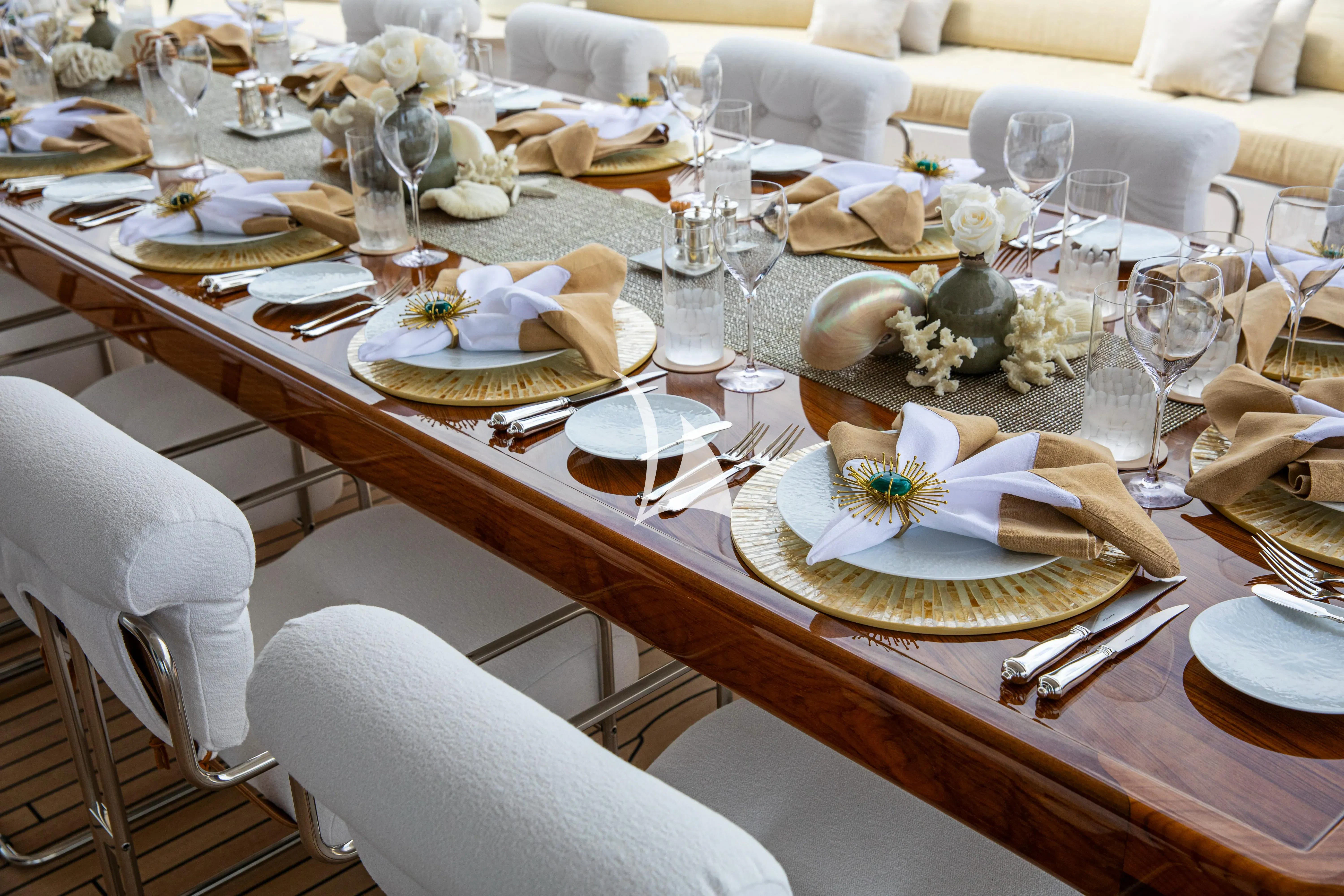 a table set with place settings aboard TREEHOUSE Yacht for Sale