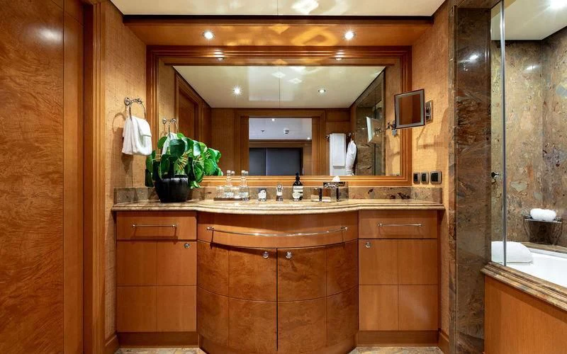 a bathroom with a large mirror aboard TREEHOUSE Yacht for Sale