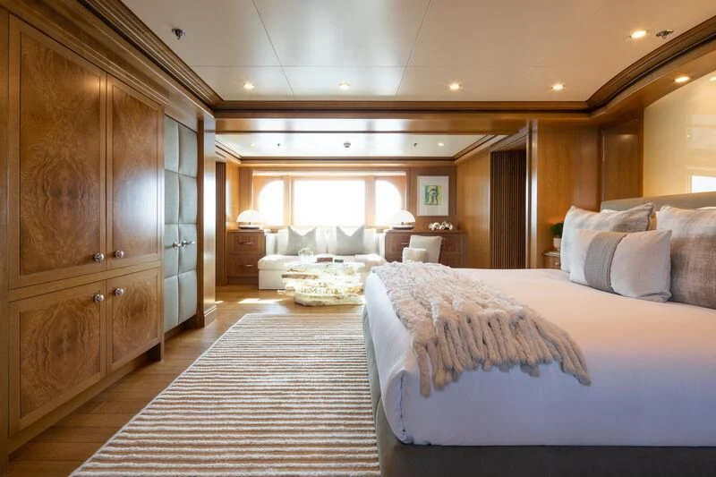 a room with a bed and a closet aboard TREEHOUSE Yacht for Sale