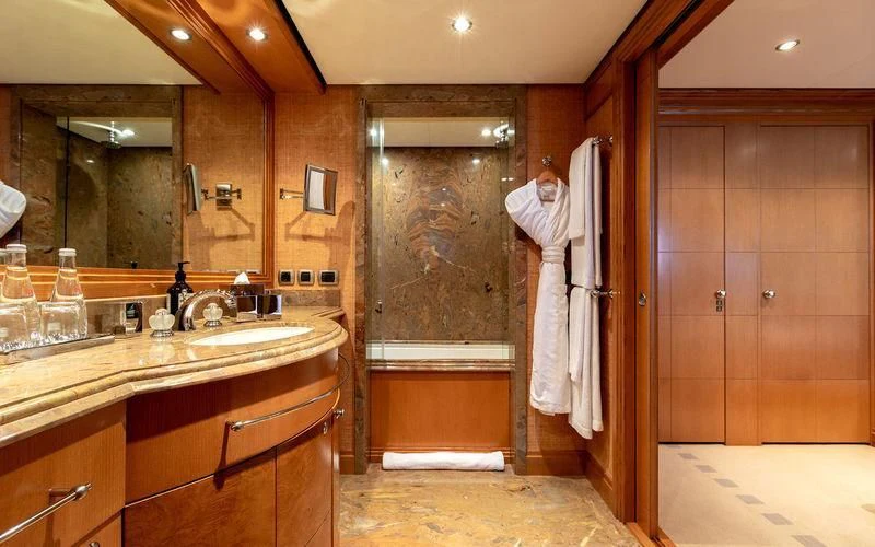 a bathroom with a large mirror aboard TREEHOUSE Yacht for Sale